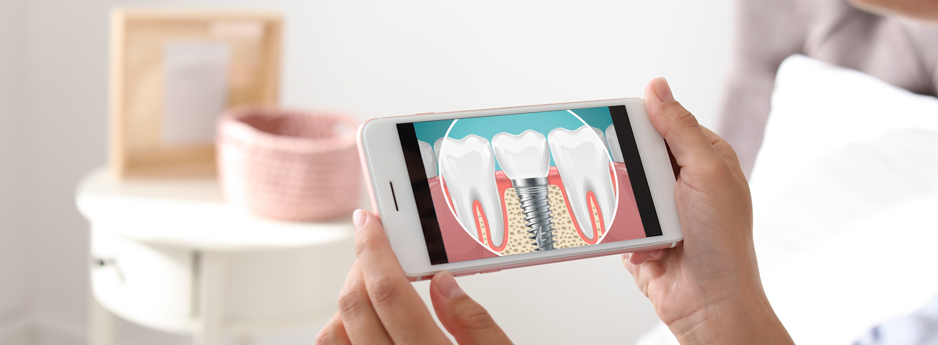 A person holding a smartphone displaying an image of a toothbrush with bristles being removed.